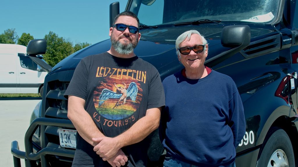 Two Safe Way Carrier drivers in front of their truck